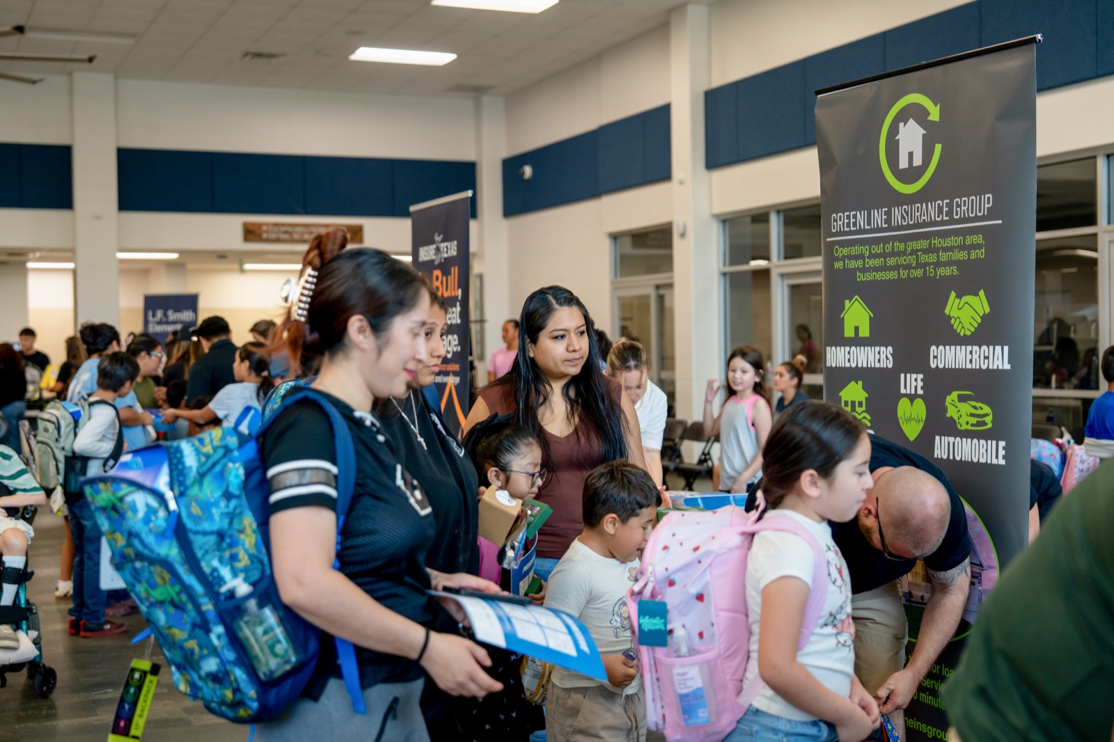 A family receiving a new backpack