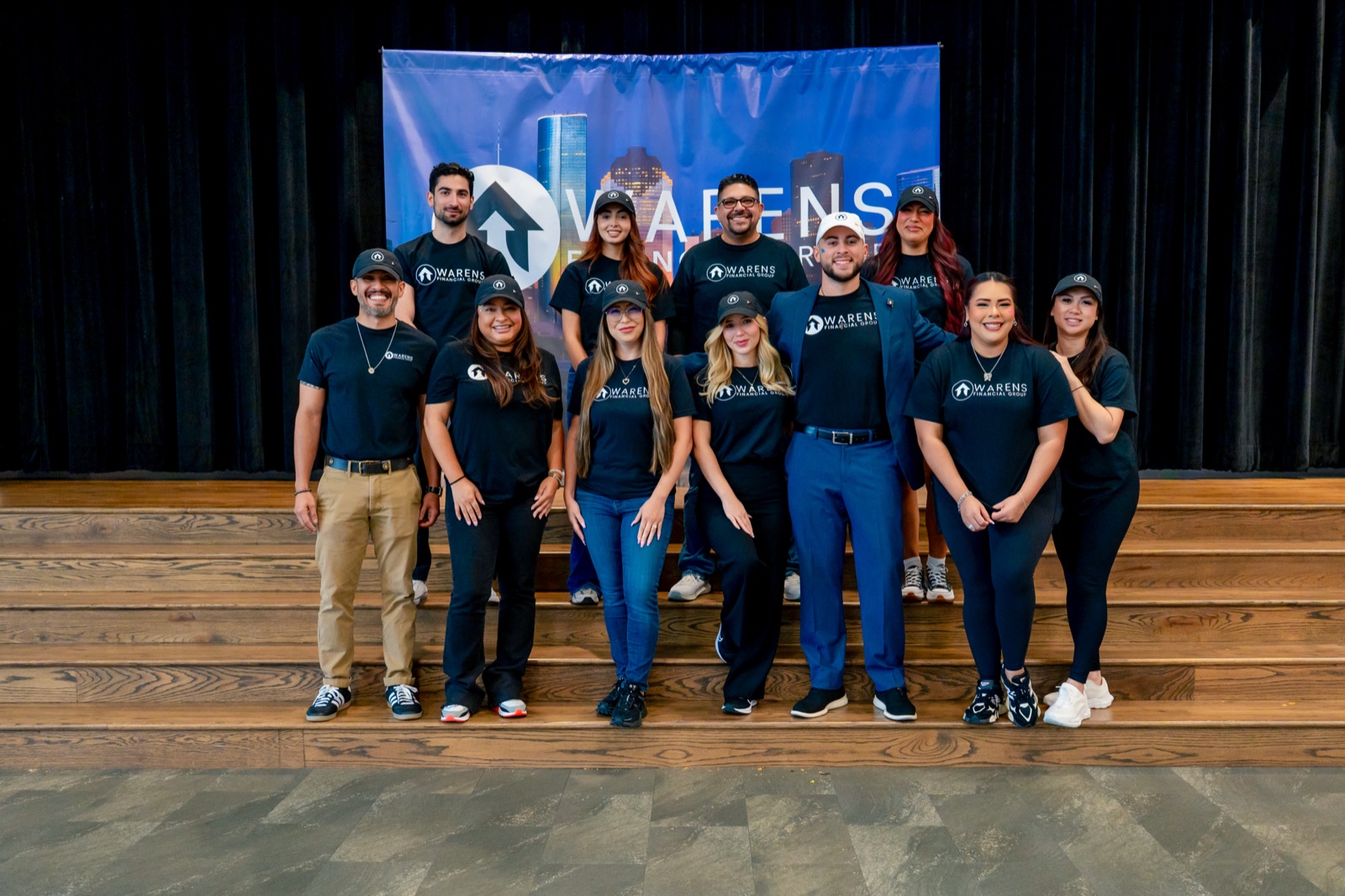 The Warens Financial Group team on stage at the 2026 Back to School Drive