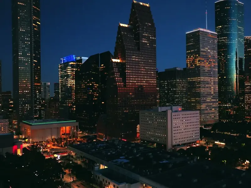 Downtown Houston at dusk with lit office towers